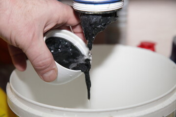 Clogging of the plastic water trap siphon of the sink in the bathroom, plumbing service