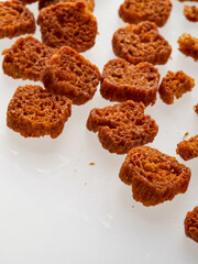 a piece of brown bread cookies on a white background
