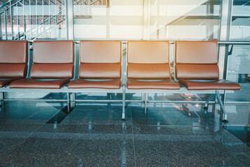 Empty seat at airport terminal waiting area.