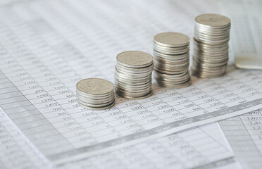 Stack of money coin on accounting sheet with selective focus, Business and financial concept. 