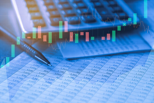 Pen and Calculator on accounting report, Business and Financial concept with blue filter