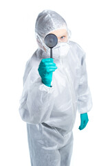 The epidemic of the Chinese coronavirus. A biologist in a protective suit and mask is holding a magnifying glass to search for a medicine. Biohazard. Flu, Ebola, Tuberculosis Vaccine.