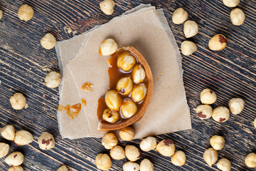 round tartlet with soft caramel and roasted hazelnuts