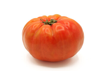 A whole pink tomatoes isolated on a white background