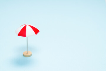 Red umbrella on a blue background.