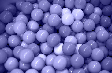Texture: pastel color plastic balls toned with very peri. close up, soft focus