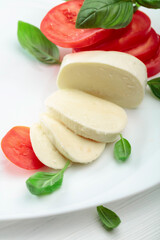 Mozzarella with tomatoes and basil.