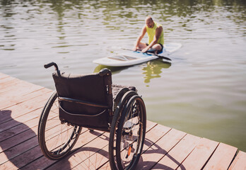 Person with a physical disability ride on sup board