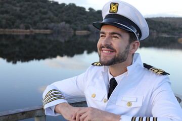 Ship captain with elegant uniform - obrazy, fototapety, plakaty