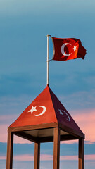 Turkish flag waving at blue sky. The flag of Turkey, officially the Turkish flag is a red flag...
