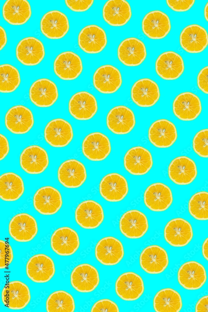 Poster lemon slices pattern, top view of lemon slices isolated on a blue background.