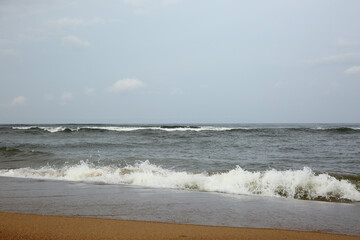 Wave of the sea falls beautifully on the shore and the sprays fly