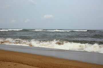 Wave of the sea falls beautifully on the shore and the sprays fly