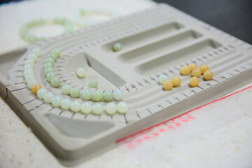 Processing of jade. Industrial jewelry manufacturing. Sacred stone of China