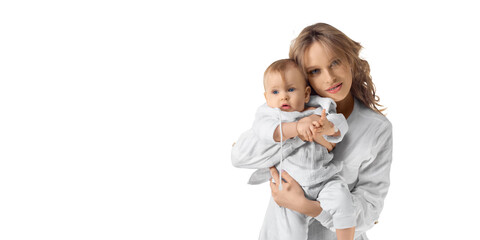 Happy mom holds her baby in her arms and looking at camera. Isolated on white. Format photo 2x1.
