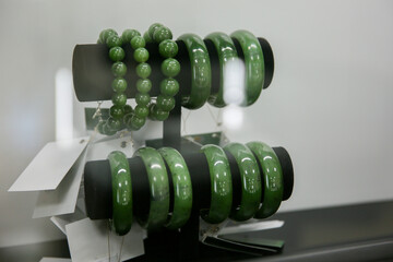 Jade bracelet in the jewelry store Precious stone jade. Sacred stone of China © Артем По