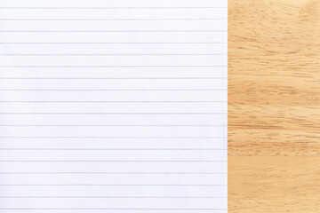 Obraz premium Notebook white Lined Paper on wood desk Background