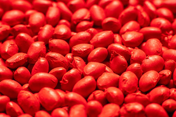 Red polymer dye in granules, background texture