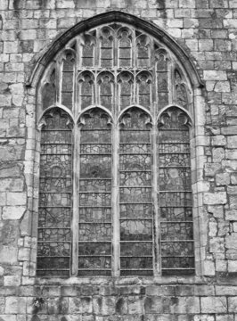 old window on the historic medieval cartmel priory in cumbria now the parish church of st micheal and mary