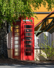 Old vintage red telephone box in the centrum of Valldalen