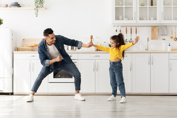 Adorable Little Arab Girl Having Fun With Her Dad At Home