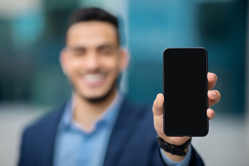 Fototapeta Unrecognizable businessman showing smartphone with blank screen obraz