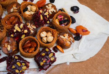 Dried fruits baklava and Turkish delight with pistachios and nuts, close-up view .