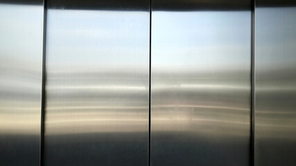 Plakat Reflection of light on a shiny metal surface,stainless steel panel background.