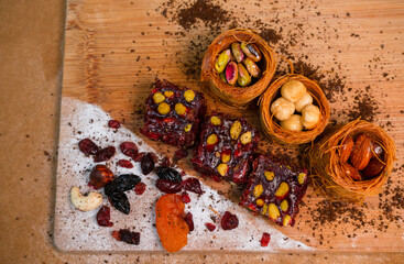 Dried fruits baklava and Turkish delight with pistachios and nuts, close-up view .