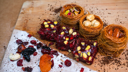 Dried fruits baklava and Turkish delight with pistachios and nuts, close-up view .