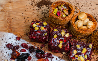 Dried fruits baklava and Turkish delight with pistachios and nuts, close-up view .