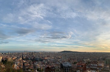 Fototapeta na wymiar View of Barcelona city skyline from Mirador de les bateries. Sagrada de Familia and other famous sightseeing objects in the background. Aerial, panoramic, scenic view. Barcelona, Catalonia, Spain