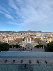 Skyline of Barcelona city. Placa d'Espanya, Venetian towers, Arenas de Barcelona shopping mall and famous Magic fountain of Montjuic. Panoramic, scenic view. Barcelona, Catalonia, Spain