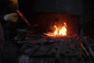 Metal work, fire and forged iron and wrought iron in fire furnace.