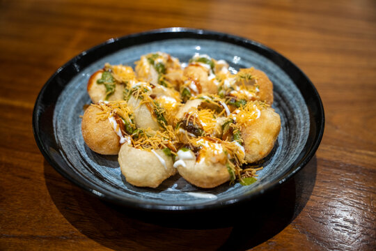 A plate with ready to eat panu puri or golgappa, Indian streetfood snack