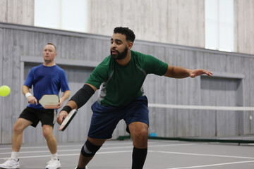 A pickleball dink during a doubles game
