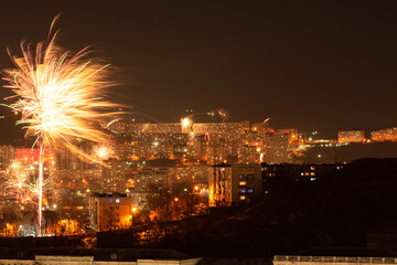 Fireworks in the city at night during New Year celebration. Soft focus background