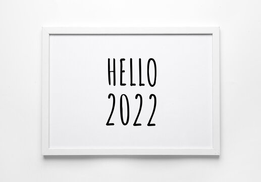 Photo frame with text HELLO 2022 on white background