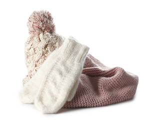 Knitted mittens, scarf and hat on white background