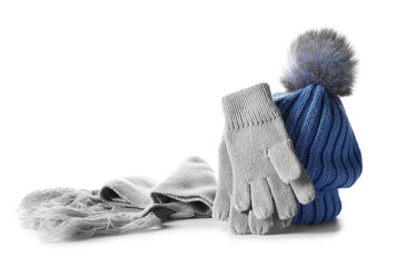 Warm gloves, scarf and hat isolated on white background