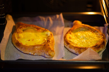 Khachapuri in Adjarian. Khachapuri in the oven. Cooking khachapuri at home.
