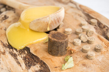 Propolis is a substance collected by bees from plants. Wax has therapeutic properties. Natural product.