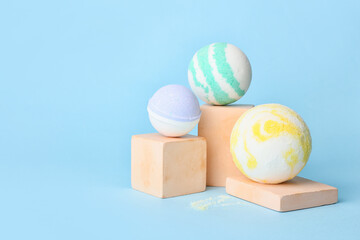 Composition with bath bombs on blue background
