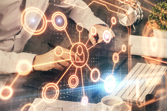 Double exposure of man's hands holding and using a phone and social network theme drawing.