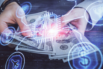 Multi exposure of technology drawing hologram and us dollars bills and man hands. Data concept