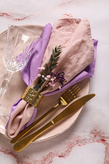 Festive table setting with flowers on light background