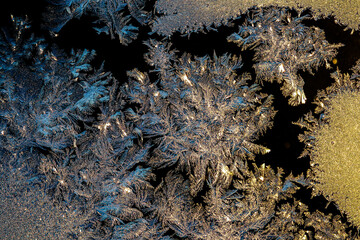 Beautiful natural frosty patterns on a frozen winter window