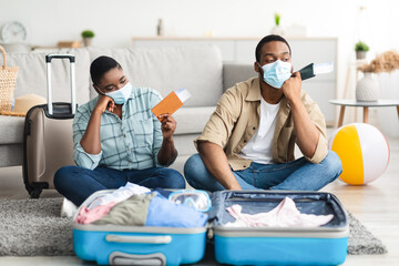 Sad Black Tourists Couple After Tour Cancellation Holding Tickets Indoor