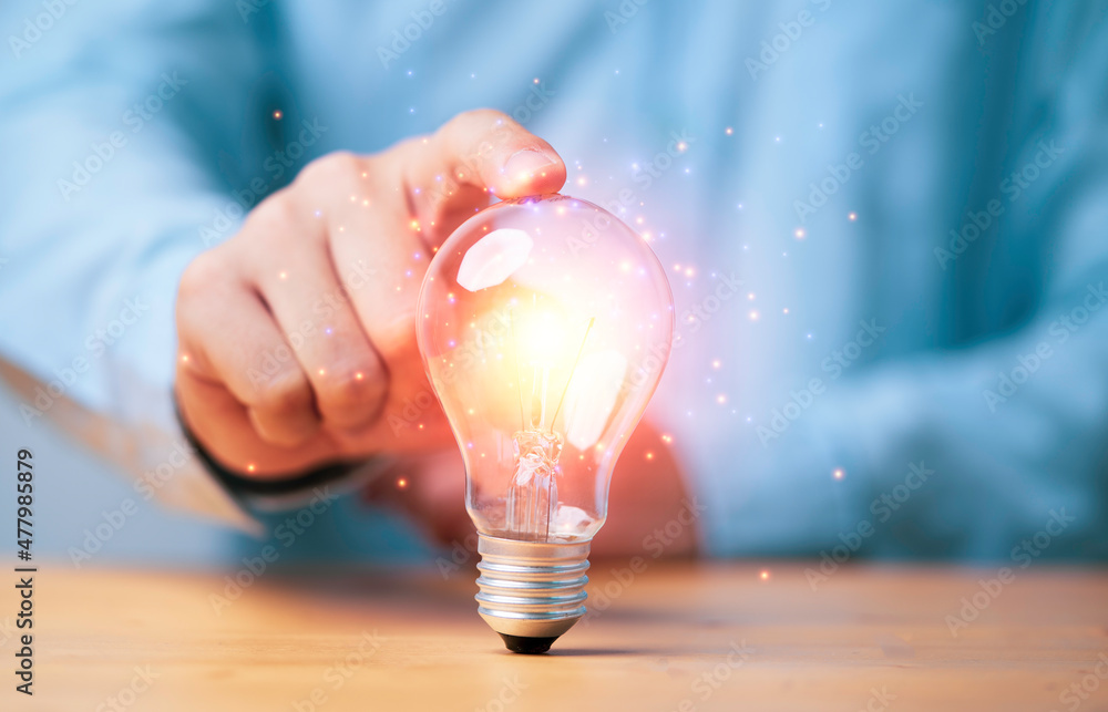 Poster hand touching to glowing lamp or lightbulb for creative thinking idea and problem solving or solutio