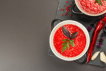 Spicy autumn tomato soup. Healthy hot food, garlic, chili, basil